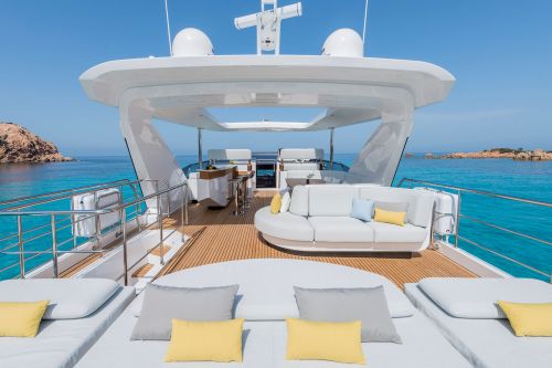 Flybridge of a yacht with bar and sun pads during a yacht charter vacation