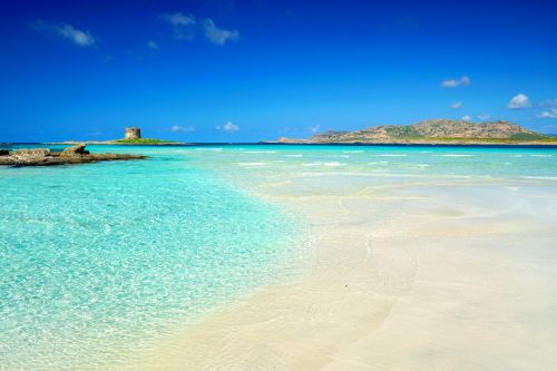 The beach of La Pelosa and its turquoise lagoon in Sardinia