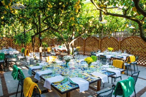 Tables set up under the lemon trees at the Da Paolino restaurant in Capri