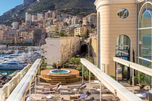 Les Thermes Marins Monte-Carlo in Monaco with the terrace overlooking Port Hercule and the charter yachts