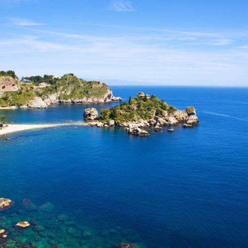 Seascape in Taormina in Sicily with Isola Bella and its beach