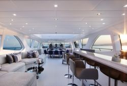 The interior of a yacht with its salon and large panoramic windows
