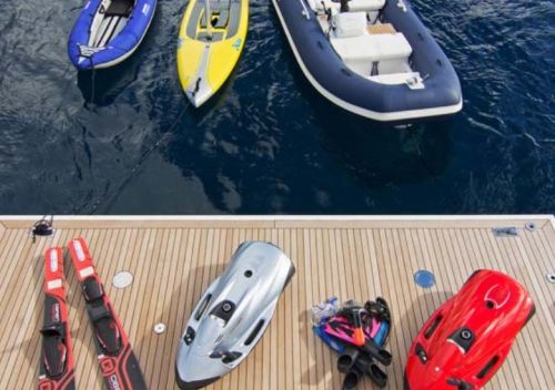 A collection of water toys on a yacht's swim platform