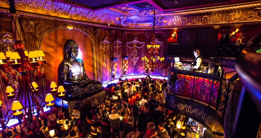 The Buddha Bar in Monaco during a festive party evening with a luminous atmosphere and a DJ