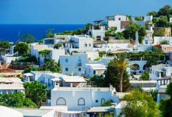 A residential area with white houses on the island of Panarea in Sicily