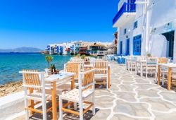 A seafront Greek taverna restaurant on the island of Mykonos in Greece