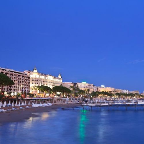 Night view of the city of Cannes with the famous Boulevard de La Croisette and the Carlton Hotel