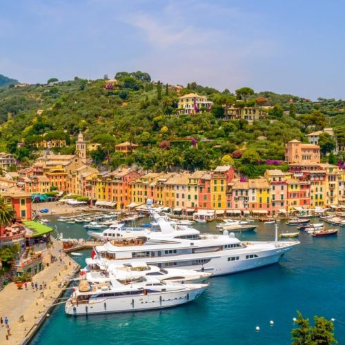 The colourful village of Portofino with luxurious yachts moored in the marina