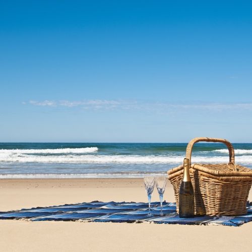 A picnic hamper on a beautiful beach