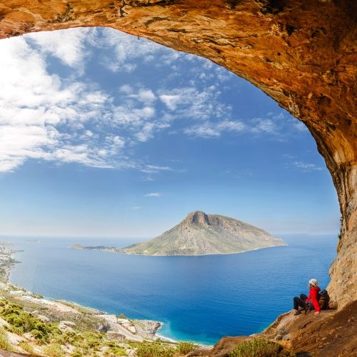 A hiker on the island of Kalymnos with its cliffs and spectacular scenery