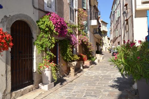 A street of Cannes old district Le Suquet during the summer