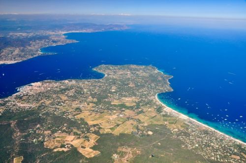 Panorama over the Gulf of St Tropez and the beach of Pampelonne with charter yachts