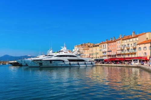 The port of St Tropez with the Caf Snquier and moored charter yachts 