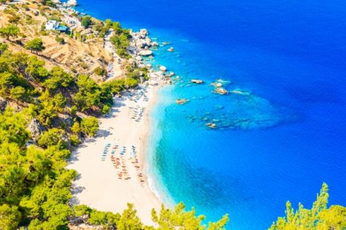 A white sandy beach and turquoise waters on the secret Greek island of Karpathos