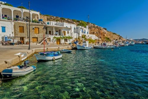 Fishing boats and a fishing village on the Greek island of Sifnos