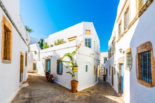 Streets and typical houses of the island of Patmos in Greece on a beautiful sunny day