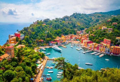 Aerial view of the colourful marina of Portofino in Italy with yachts moored in the port