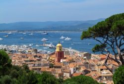 Panoramic view of the village of St Tropez and its bay with yachts at anchor