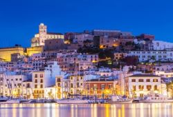 The port of Ibiza illuminated at night with its moored boats