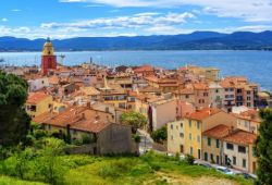 The colourful village of St Tropez with its bell tower under a beautiful blue sky