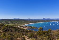 The superb sandy beach of Pampelonne near St Tropez with charter yachts at anchor