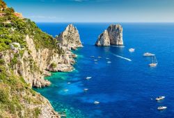 The Faraglioni are rock formations located off the island of Capri