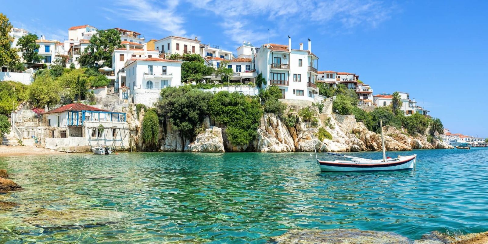 https://www.talamare.com/medias/The old port of Skiathos under a beautiful blue sky in the Sporades Islands in Greece