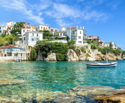 The old port of Skiathos under a beautiful blue sky in the Sporades Islands in Greece