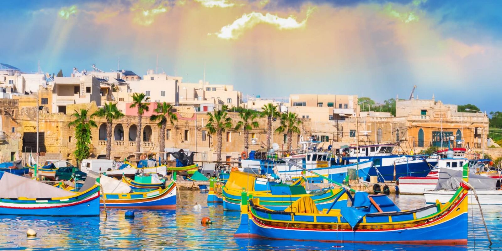 https://www.talamare.com/medias/Colourful boats in the old fishing village of Marsaxlokk on the island of Malta