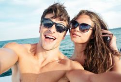 A happy couple on a honeymoon yacht charter
