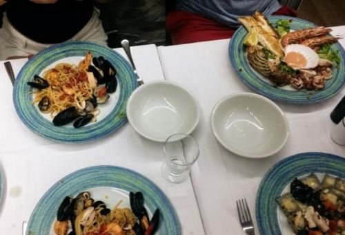 Seafood and pasta dishes in a Cinque Terre restaurant in Italy